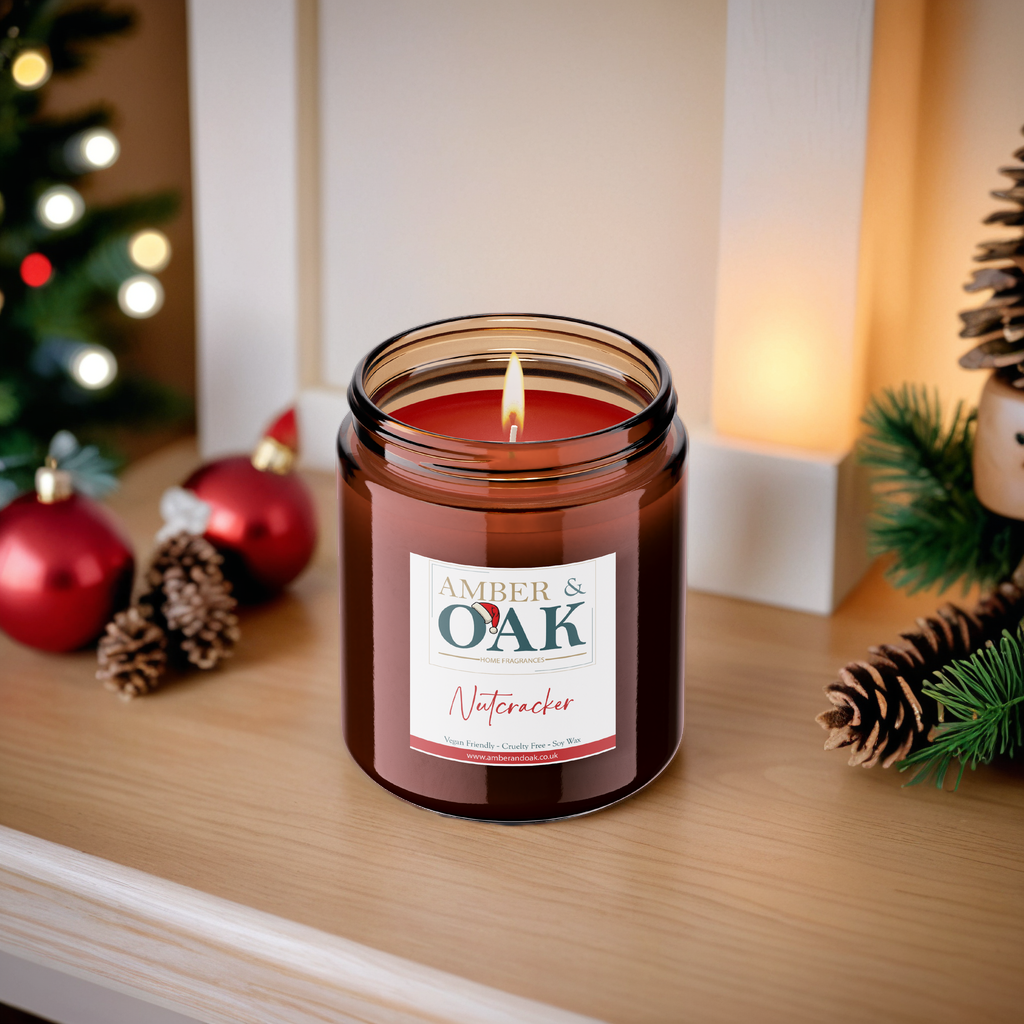 Decorative shelf featuring a collection of nutcracker-themed scented candles in elegant candle holders with warm ambient lighting.